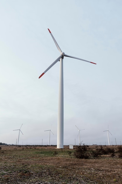 Front view of wind turbine in the field generating energy