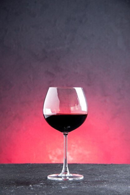 Front view wine glass on red isolated background