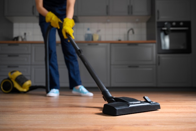 Free photo front view woman cleaning home