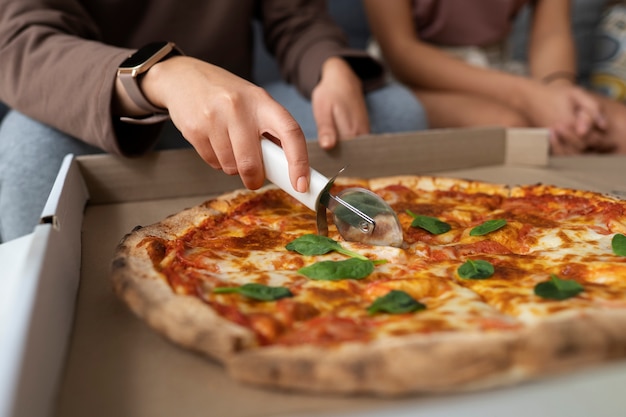 Free photo front view woman eating delicious pizza