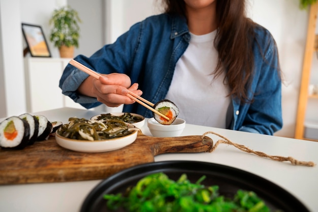 Free Photo front view woman eating at home