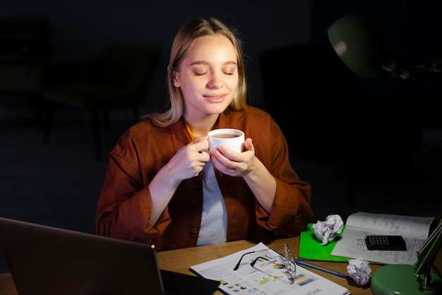 Free photo front view of woman enjoying coffee