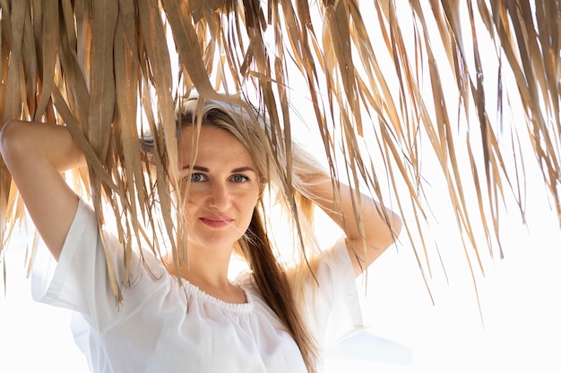 Front view of woman enjoying her time at the beach