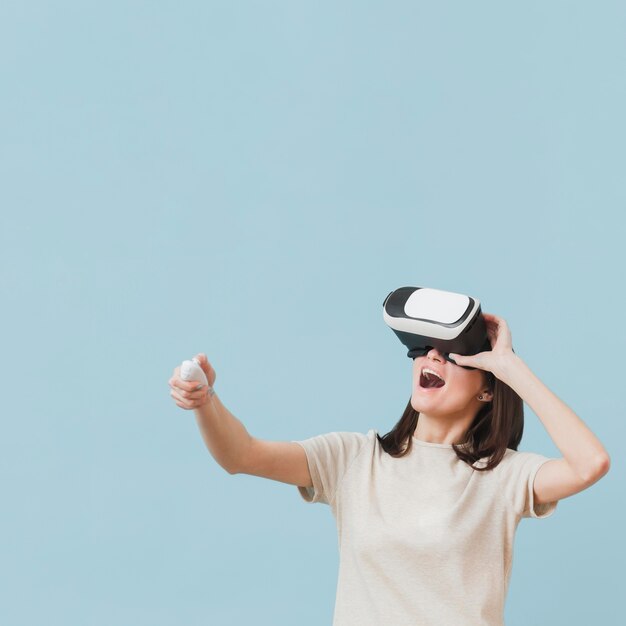 Front view of woman enjoying her time with virtual reality headset