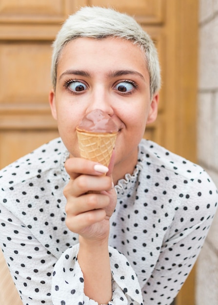 Front view of woman enjoying ice cream