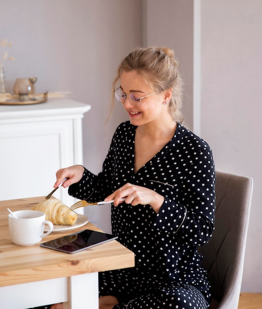 Front view of woman having breakfast