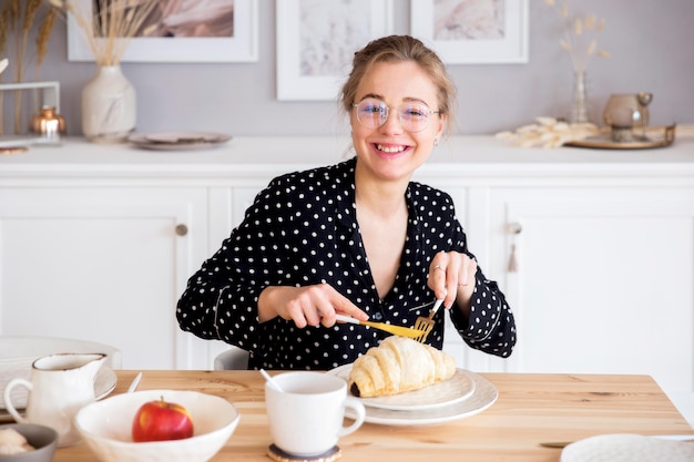 Front view of woman having breakfast