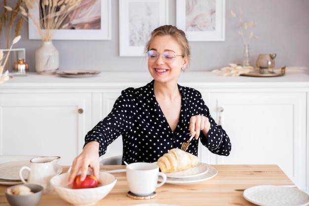 Front view of woman having breakfast