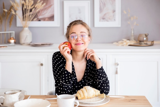 Front view of woman having breakfast