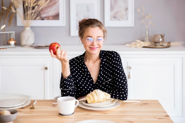 Front view of woman having breakfast