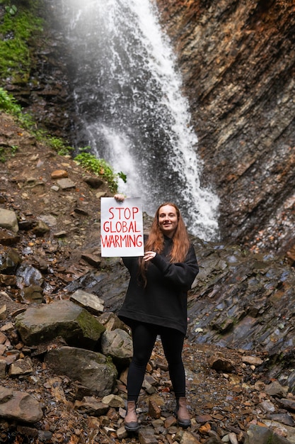 Free Photo front view woman holding banner