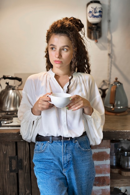 Front view woman holding coffee cup