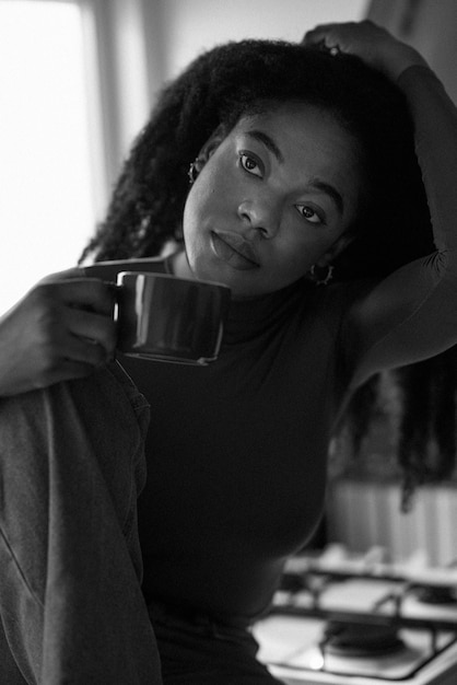 Free photo front view woman holding coffee cup