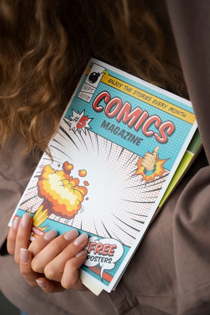 Free photo front view woman holding comics