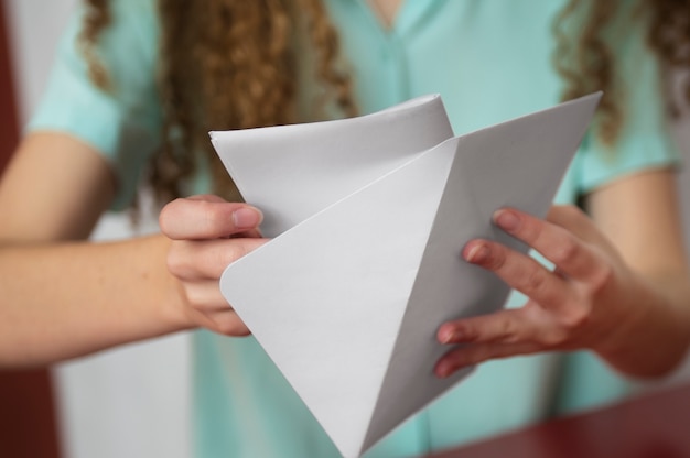 Front view woman holding envelope