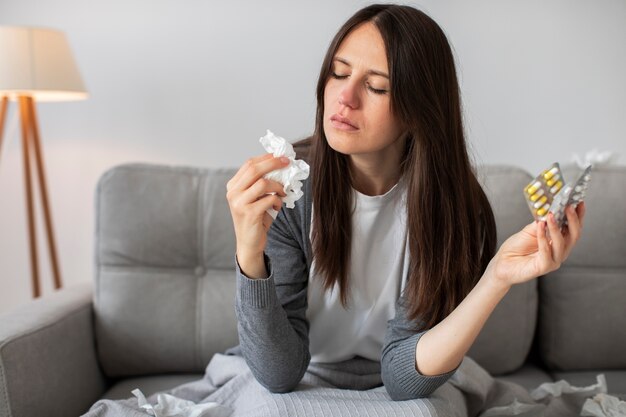 Front view woman holding medicine