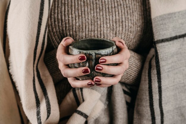 Front view woman holding mug