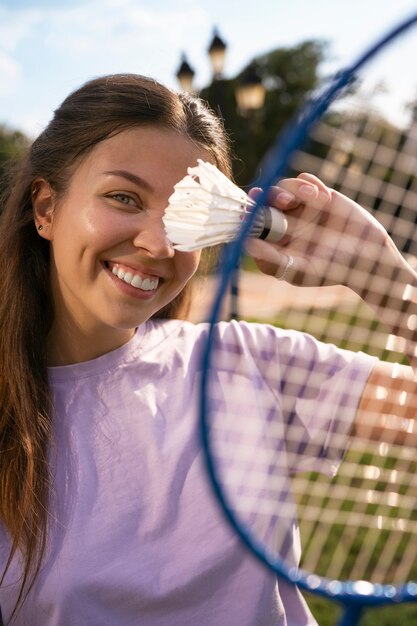 Front view woman holding racket