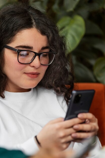 Front view woman holding smartphone