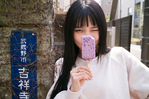 Front view woman holding tasty ice cream