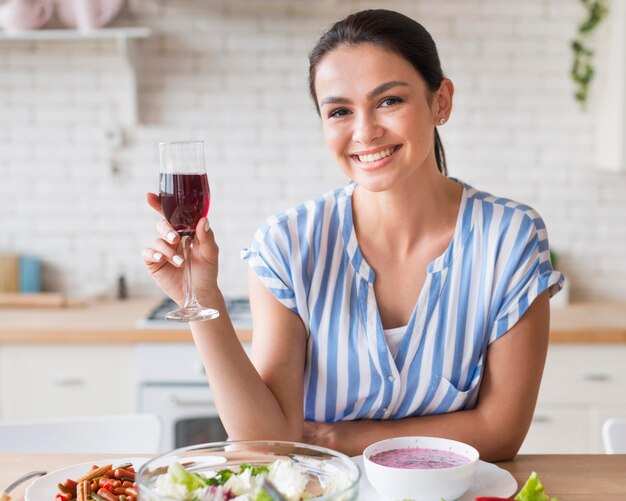 Front view woman holding wine glass