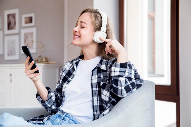 Front view of woman listening to music