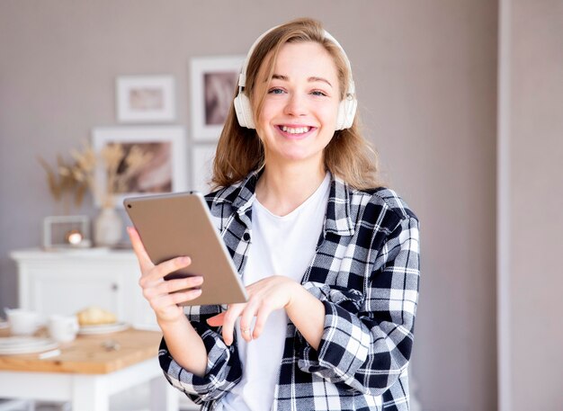 Front view of woman listening to music