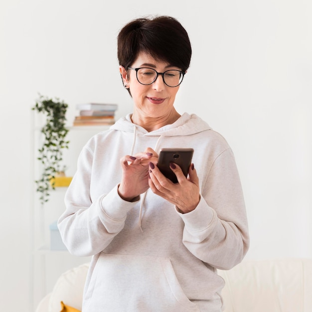 Front view of woman looking at smartphone