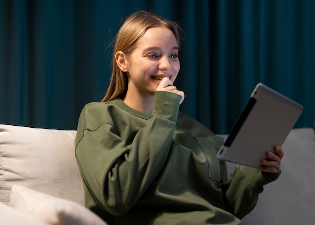 Front view of woman looking at tablet