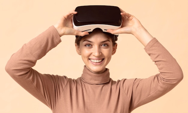 Front view woman playing on virtual reality headset