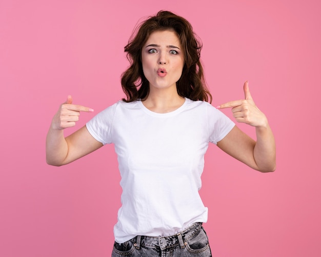 Free photo front view of woman pointing at herself