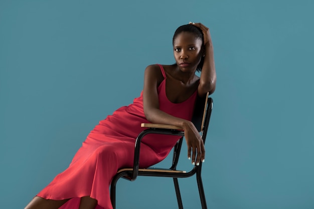 Front view woman posing on chair