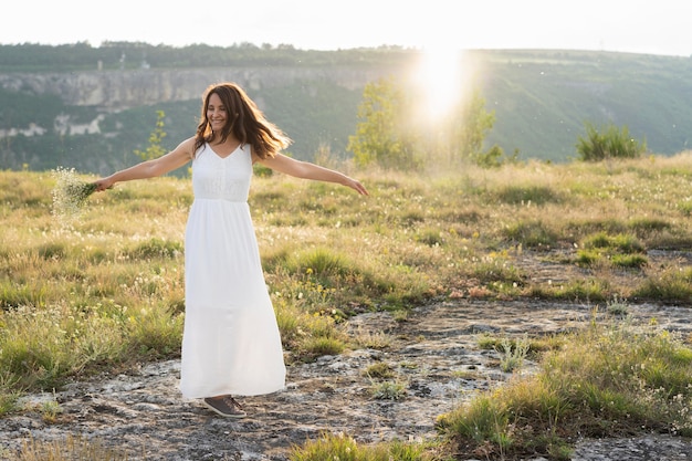 Front view of woman posing in nature