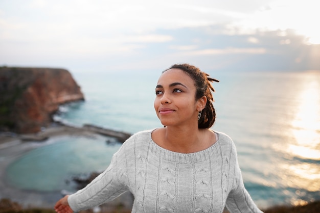 Free photo front view woman posing in nature