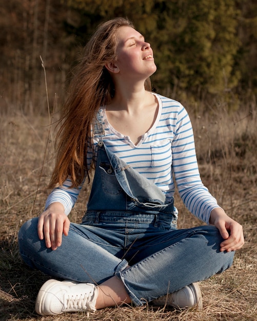 Free photo front view of woman posing in the sun