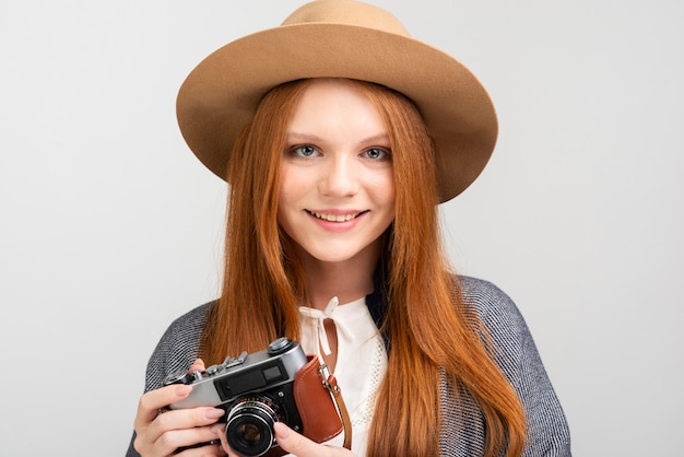 Free photo front view woman posing with camera