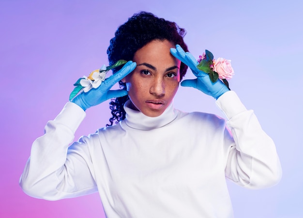 Front view of woman posing with floral gloves