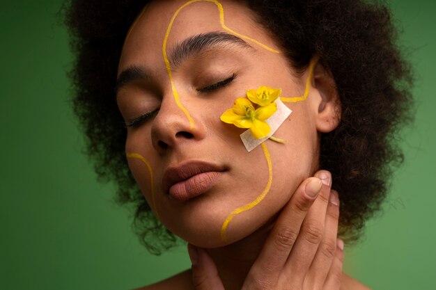 Front view woman posing with flower