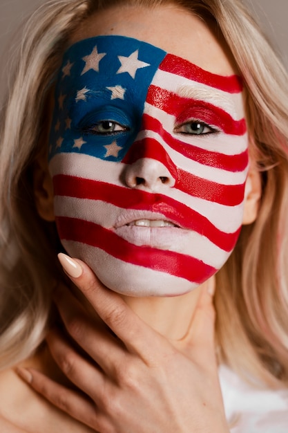 Front view woman posing with usa makeup