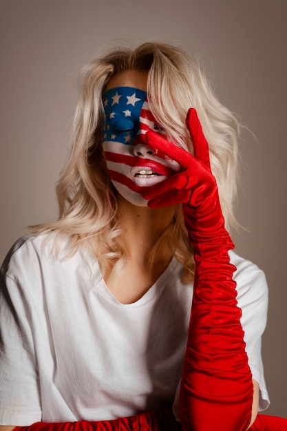 Free Photo front view woman posing with usa makeup