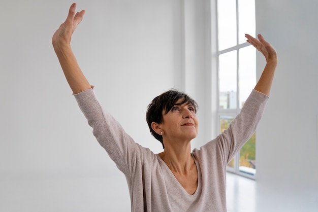 Front view woman practicing tai chi