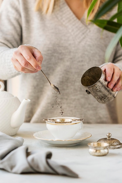 Front view of woman preparing tea