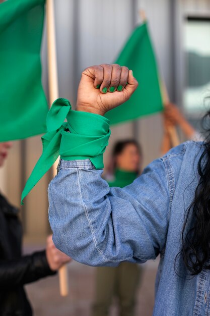 Front view woman protesting outdoors