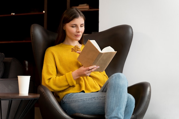 Front view woman reading book