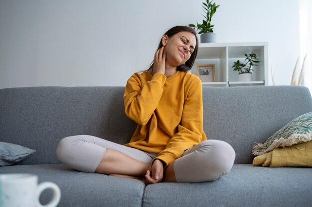 Front view woman scratching neck