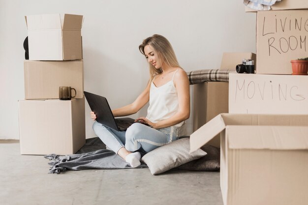 Front view woman sitting on the floor