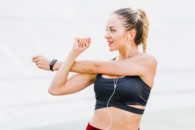 Front view of woman stretching arms