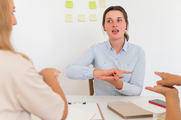 Front view of woman teaching the sign language