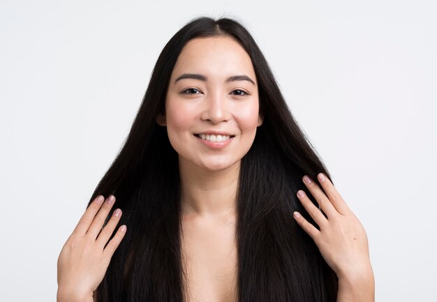 Front view woman touching her hair