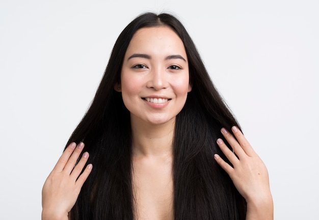 Front view woman touching her hair